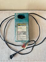 Front view of Makita charger with cord visible