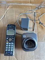 Handset, charging base and power adapter overall view