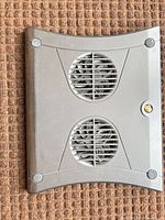 Front view showing black/gray housing and two fan grilles