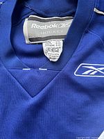 Close-up of collar showing Reebok Hockey neck tag and size label