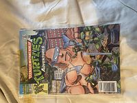 Issue #3 cover with giant Triceraton-like figure and Turtles