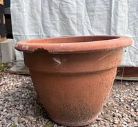 Side view of terracotta pot with chip