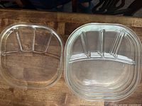 Stack of clear glass three-section plates