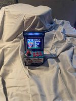 front view showing screen, controls, and Arcade Game marquee
