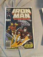 Iron Man issue 215 cover in bag with board