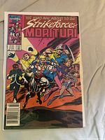 Issue with pink cover showing team charging forward (likely #2) bagged and boarded