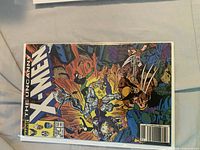 Cover of Uncanny X-Men #227 showing Wolverine and team in combat