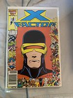 Front cover of X-Factor issue 10 in bag and board