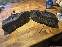 bottom view of both shoes showing tread wear