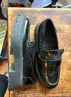 Side and top view of both loafers showing overall design, uppers and lug soles
