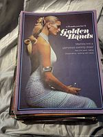 Front view of top issue showing Golden Hands Part 13 cover