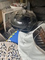 Closed Weber kettle grill among other items