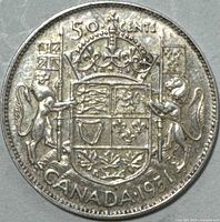 Reverse of 1951 Canadian 50 cent silver coin showing Canadian coat of arms