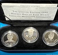 Overall view of all three medallions in presentation case