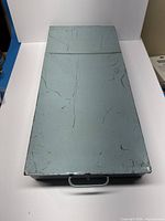 Closed tray top view showing size and surface wear