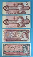 Fronts of four Canadian $2 notes from 1986, 1986, 1974, 1954