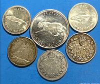 All six coins front sides visible for identification