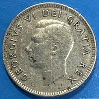 Obverse portrait of George VI showing detail and wear