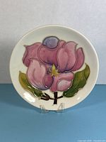 Front view of the Moorcroft Magnolia trinket dish showing floral design