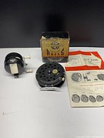 Overall lot showing both reels, box and papers