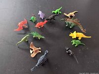 All 15 dinosaur figurines arranged in circle to show variety