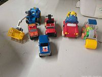 Group shot of six toy vehicles on tabletop