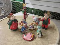 Group shot of all figurines and ornament on tabletop