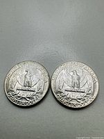 Reverse sides of two 1956 Washington quarters