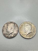Obverse of two 1964 Kennedy half dollars