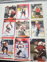 Full view of nine Flyers cards in plastic page