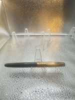 Pen capped on stand showing full length and colour
