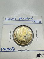 Obverse of 1970 proof 3 pence coin showing Queen Elizabeth II portrait within 2×2 flip