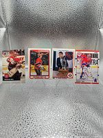 Front view of all four Patrick Roy cards