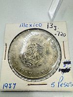 reverse displaying Mexican coat of arms, denomination, year