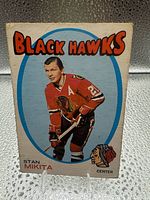 Front view of Stan Mikita card showing image, team name and card number