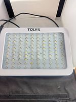 Front of TOLYS LED grow light showing 100 LED diodes