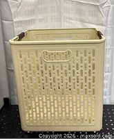 Full view of assembled beige foldable laundry basket