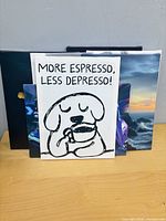 Front view showing dog coffee quote canvas with other prints partially visible