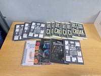 All journals laid out on tabletop showing duplicate quantities and cover titles