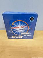 Front of sealed blue box showing product name and model