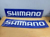 Both Shimano signs front view