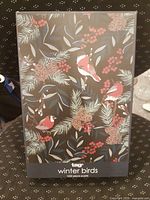 Front of Tag Winter Birds puzzle box showing artwork and branding