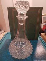 Full view of crystal decanter with stopper inserted