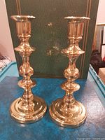 pair of brass candlestick holders front view