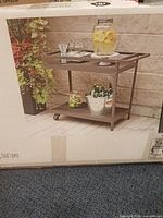 Front of sealed box showing assembled Sedgwick bar cart image
