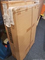 Two unopened Structube cartons containing desk parts