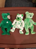 All three bears side by side on surface