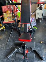 Front view of Bowflex PR3000 showing bench, leg developer, upper pulleys