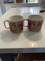 Both matching Campbell’s Soup Kids mugs side by side