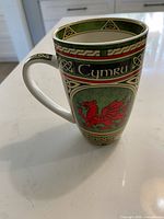 Front view showing Cymru red dragon design and Celtic knot border